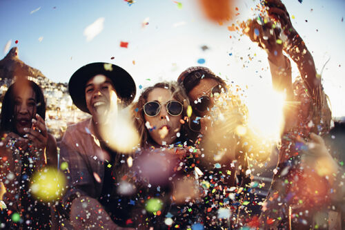 Photo of teenagers drinking and laughing 